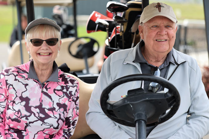 MFDA-Convention-couple-in-golf-cart