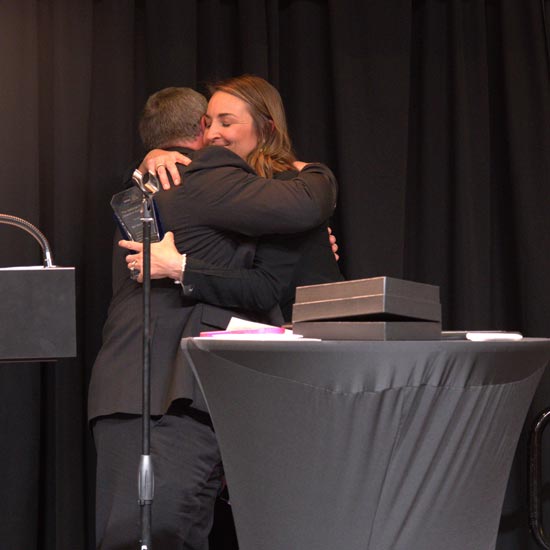 Two people hugging
